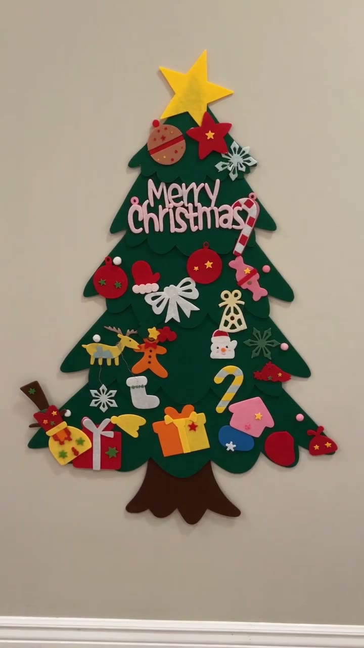 A fully decorated My First Christmas Tree on the wall